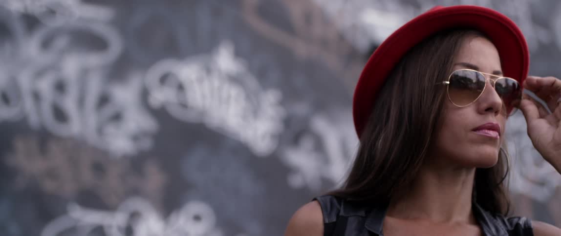 A woman is wearing a red hat