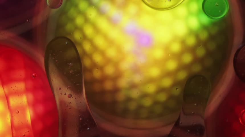Extreme abstract closeup of rotating lights with liquids and movement