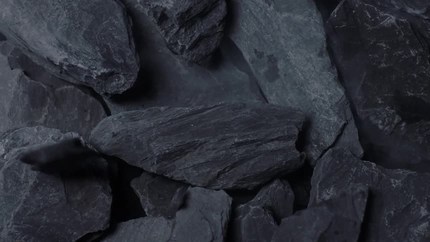 Close up view of rocks and slate is displayed
