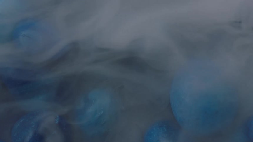 Vapor flows over blue collection of scattered blue stones