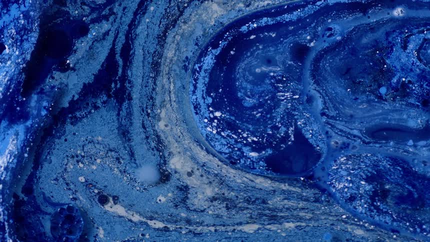 Various shades of blue paint blend together