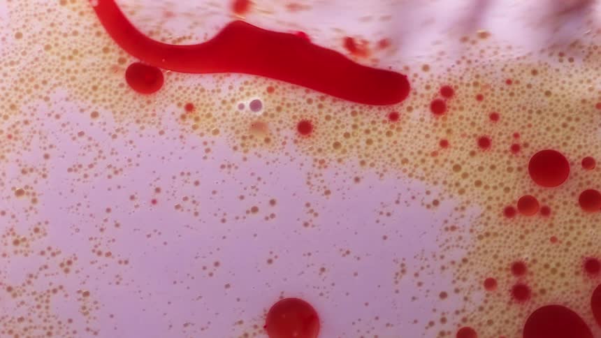 Close up view of liquid being poured is displayed