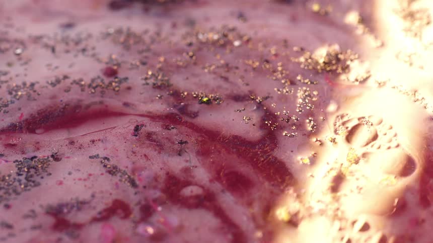 Close up view of pink paint is displayed