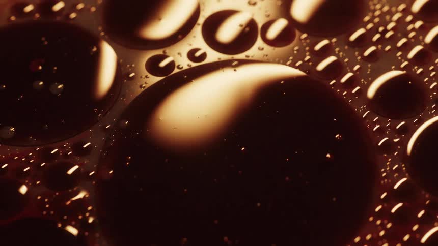 Close up view of a brown beverage is displayed