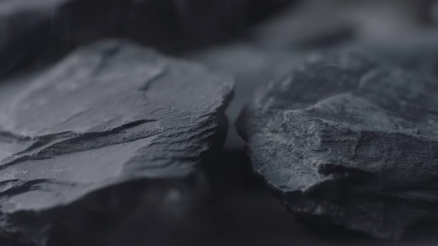 Smokes wisps around rocks