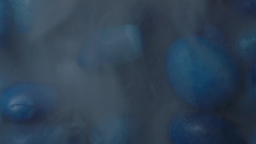 Mist rolling over blue smooth stones