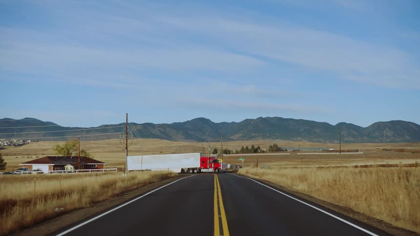 The truck is traveling on the highway