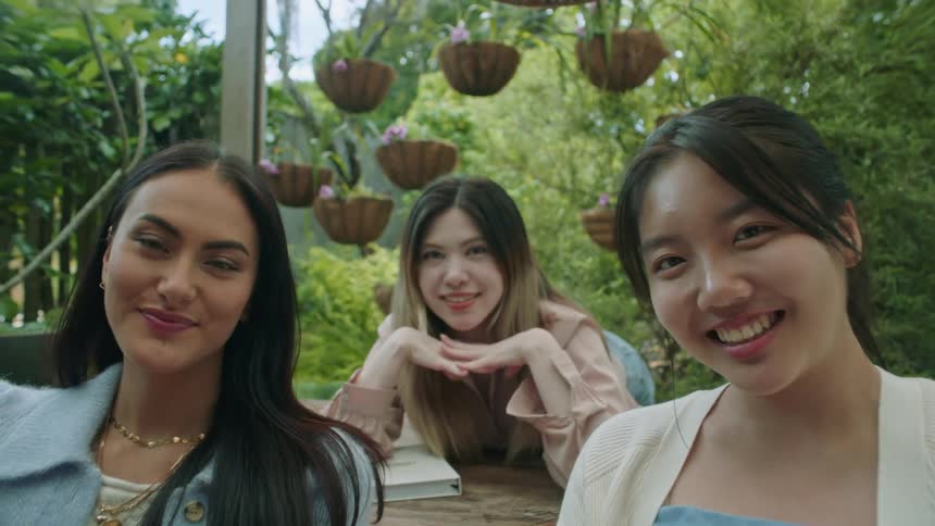 Happy group of friends have fun while taking a selfie in the garden