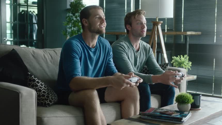 Two friends are playing video games together