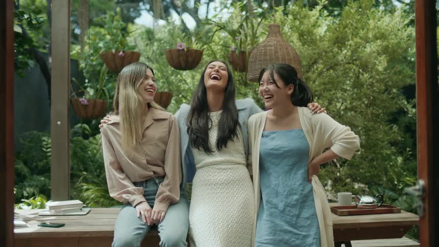 Friends are laughing and hanging outdoors in the day time
