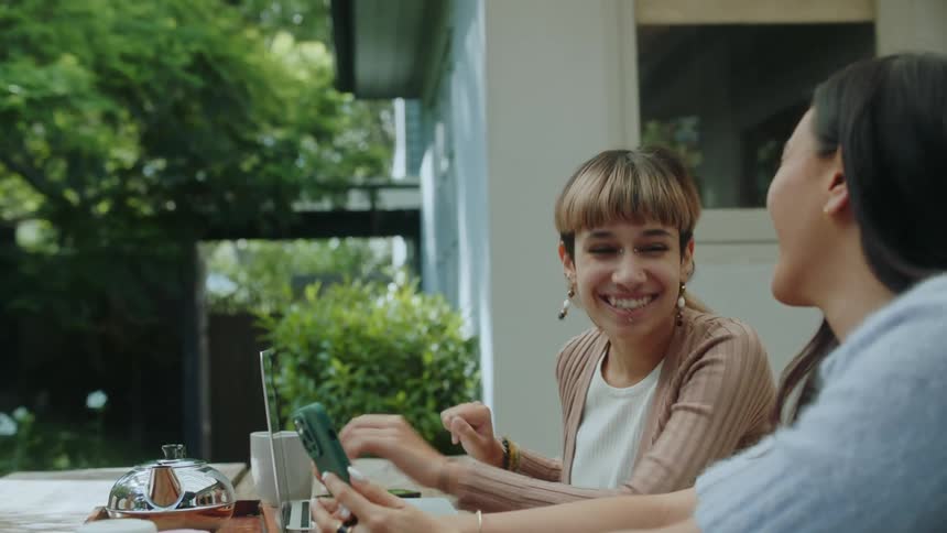 Friends are outdoors laughing and having fun