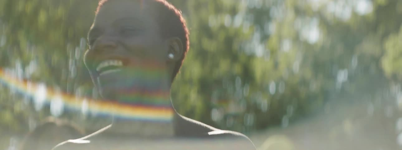 A black woman dances outdoors