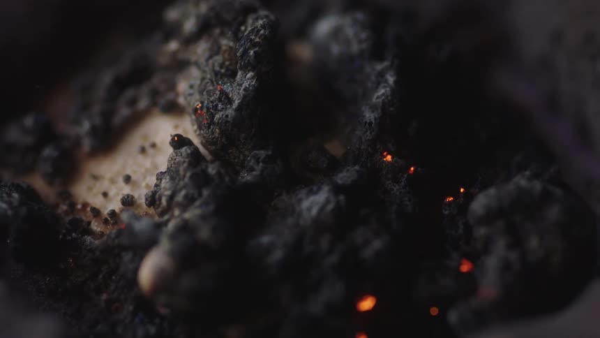 Close up view of a bonfire is displayed