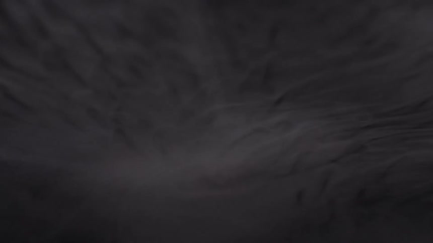 A light layer of a foggy substance hangs in the air overhead
