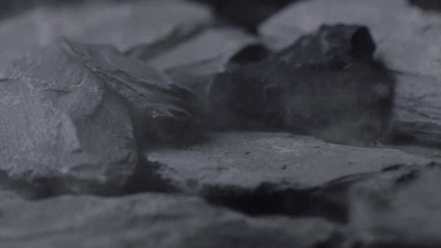 Rocks being dropped on other rocks and breaking