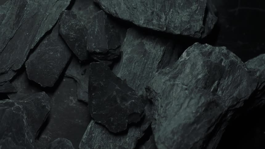 Black and gray rocks and boulders piled onto one another
