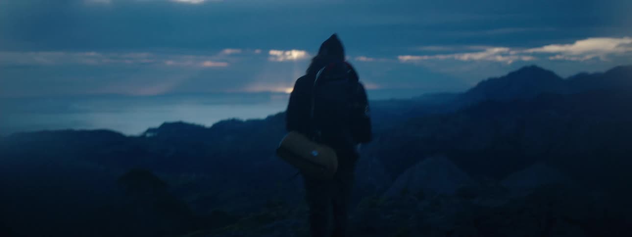 A person is hiking outdoors during the morning time