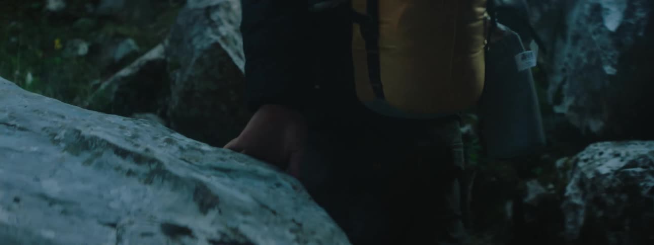 A man is climbing up the mountain