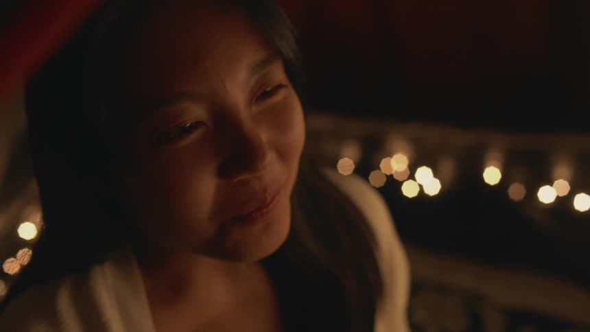 A young woman is smiling and she looks happy