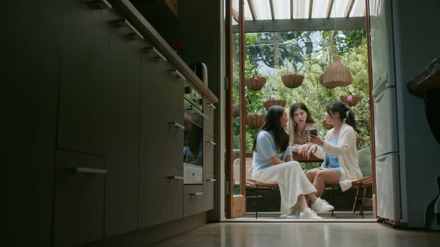 Friends are hanging out outdoors in the middle of the day time