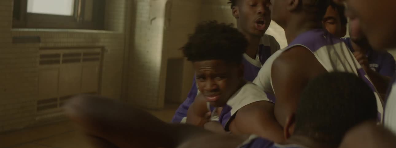 A player falls in a basketball game and a fight breaks out