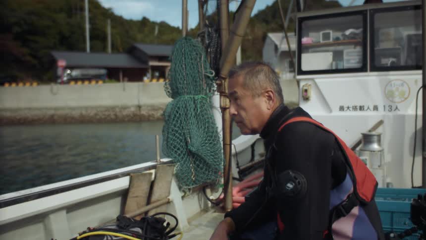 The view is of a man that is on a boat during the day time
