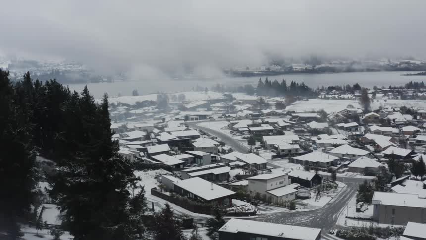 The view is of the town area around the winter time