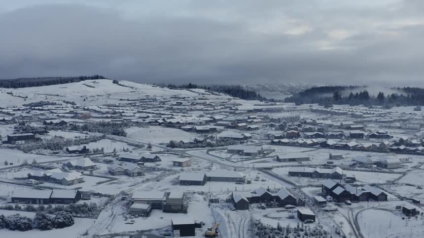 Aerial view of a suburban neighborhood during winter
