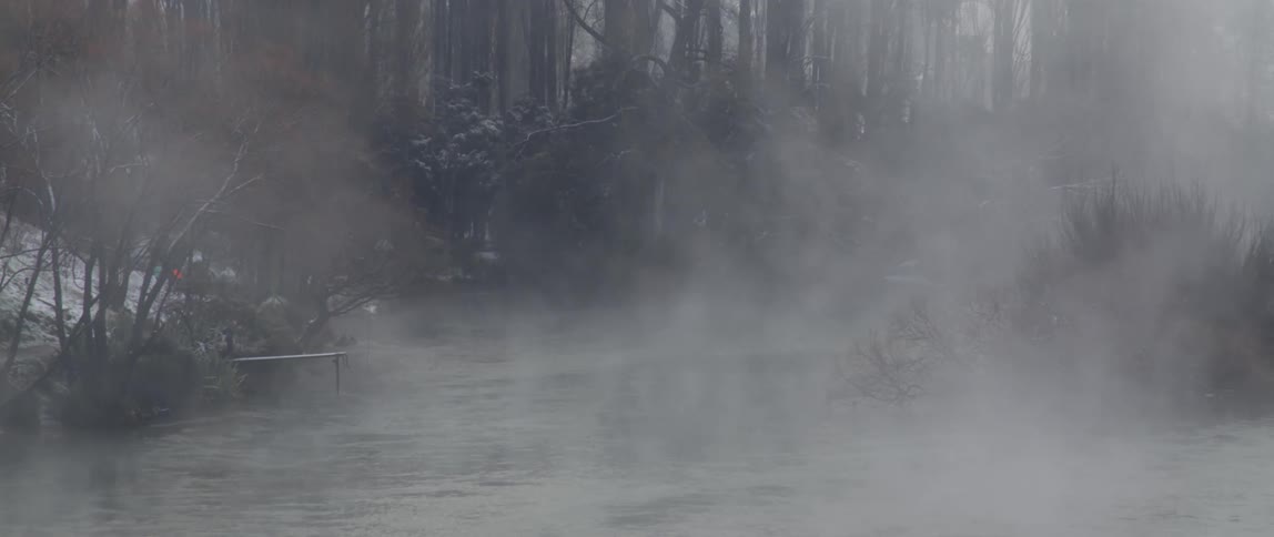 Steam or mist over the surface of a lake at winter
