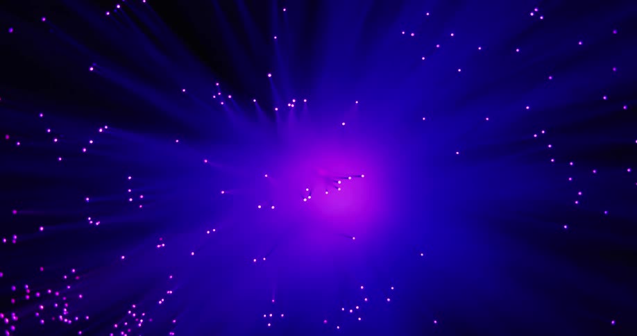 Light rays and dots surround bright core that changes colors