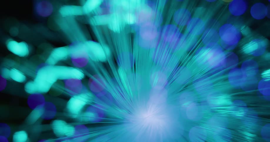 Rays of light rotate and turn as they change colors and orbs float among the glowing light