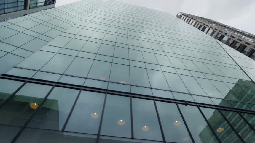 The windows on the tall buildings are reflective