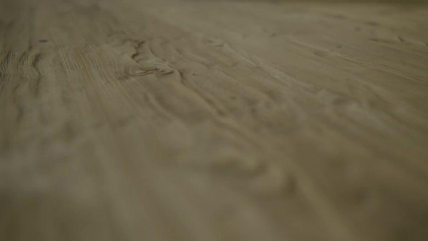 Close up of the rough surface of a slab of wood