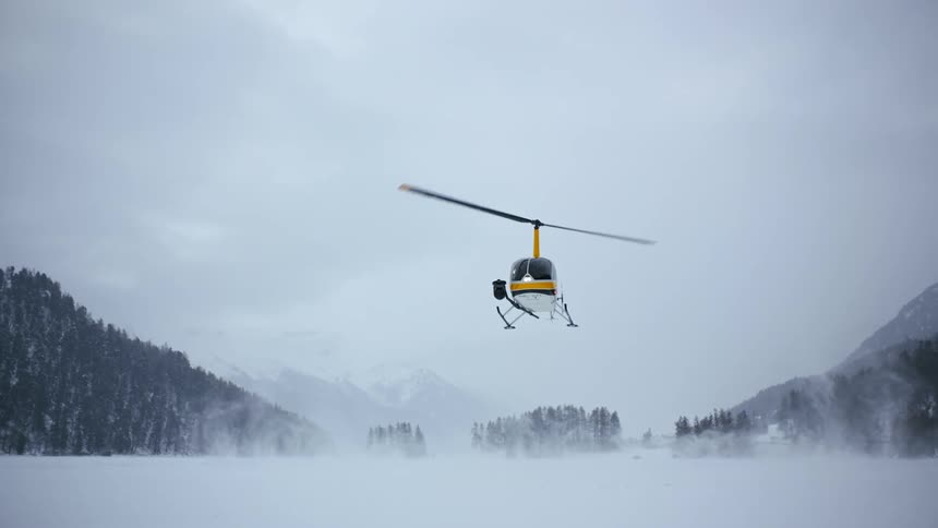 Slow Motion: Helicopter Landing on Snow-Covered Field