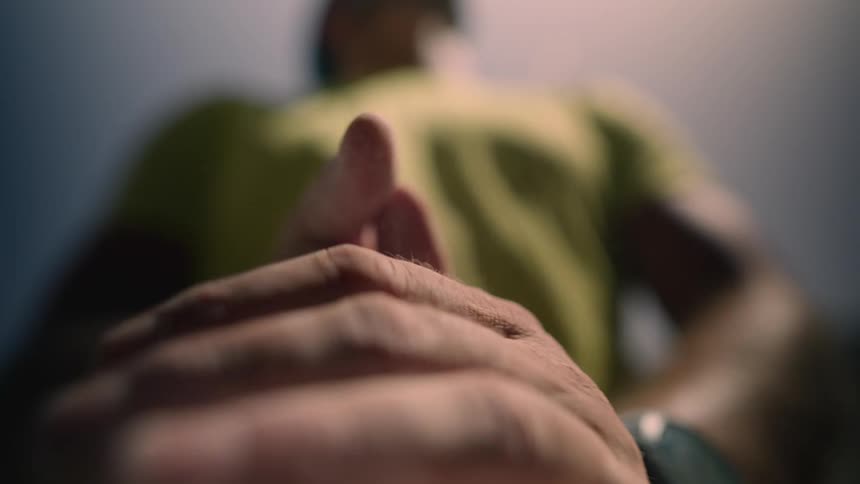 Man preparing for race or some type of exercise or athletic event claps hands together and makes two fists