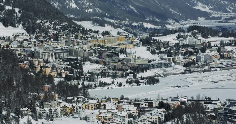 Aerial View of Snowy Mountain City in Winter