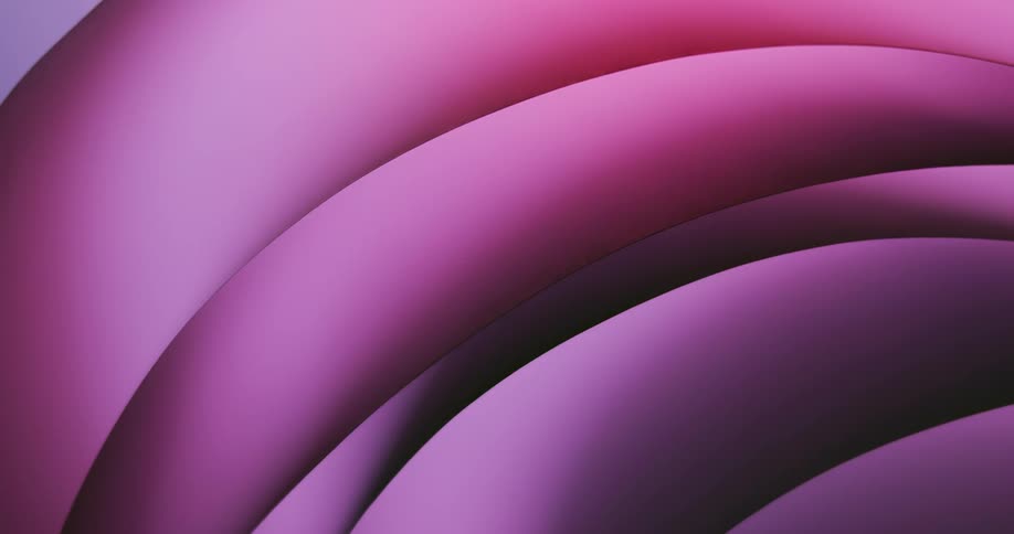 Light shines on a shiny rounded pink and lavender object as it slowly moves