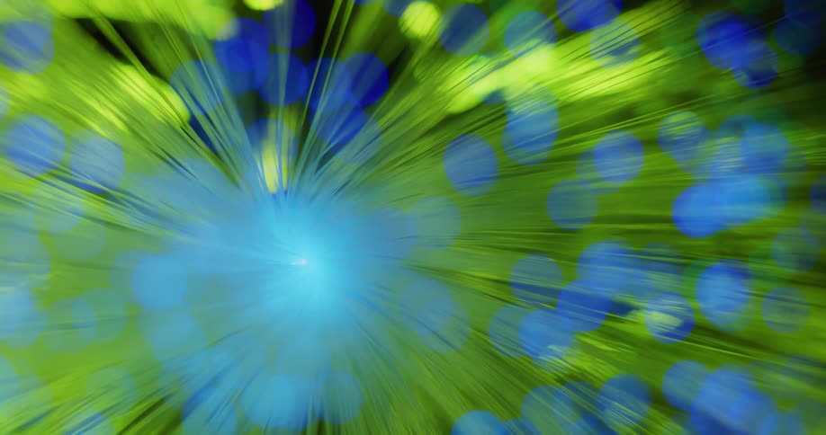 Close up of the colorful strands of a fiber optic lamp changing colors