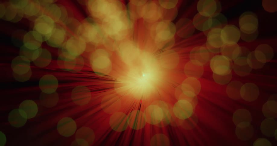 An up close of a light projector with red spikes coming out of the center