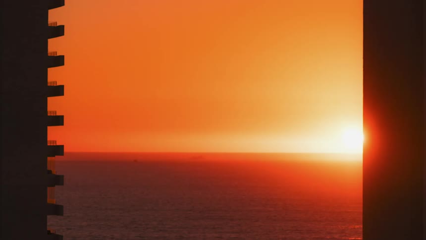 Time lapse of the sun going down over the ocean