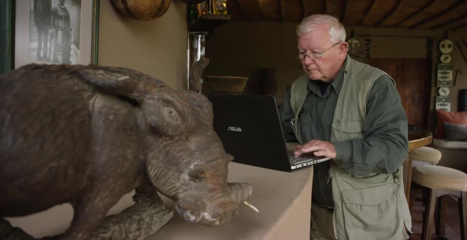 A man is using a laptop