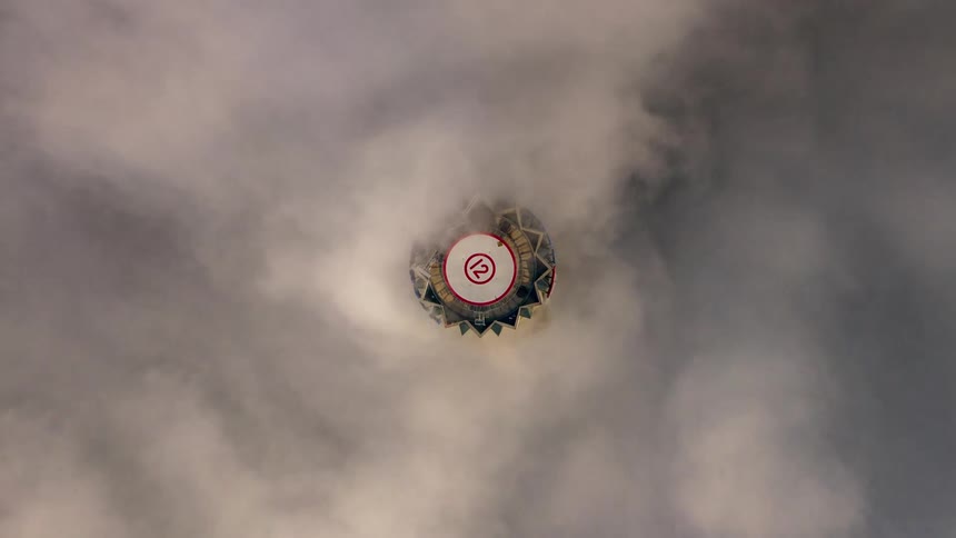 Aerial view of skyscraper covered in fog