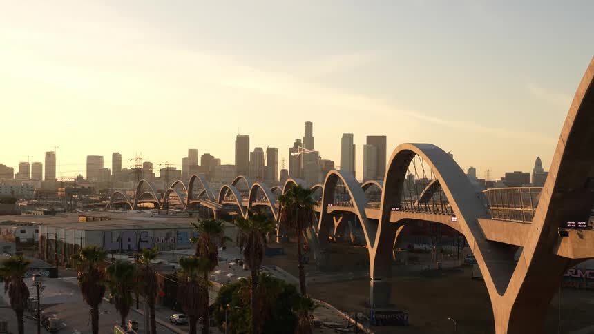 Time lapse of sixth street viaduct bridge and city skyline