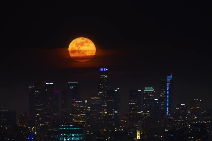 Aerial view of the moon over Los Angeles during the night time