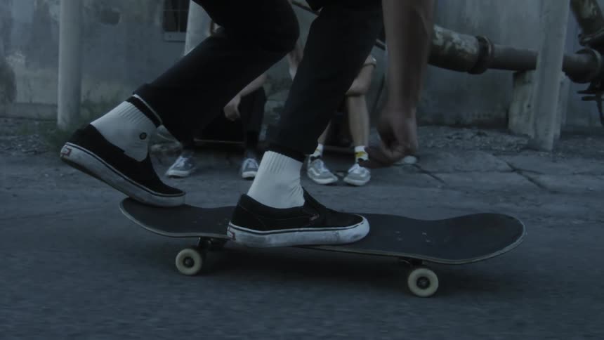 The camera spins with a skateboard twisting through the air mid-trick
