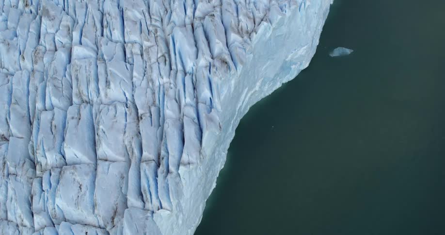 Land along the coast is covered with snow and ice