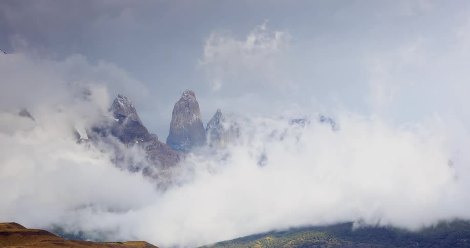 Clouds move around in front of the mountains