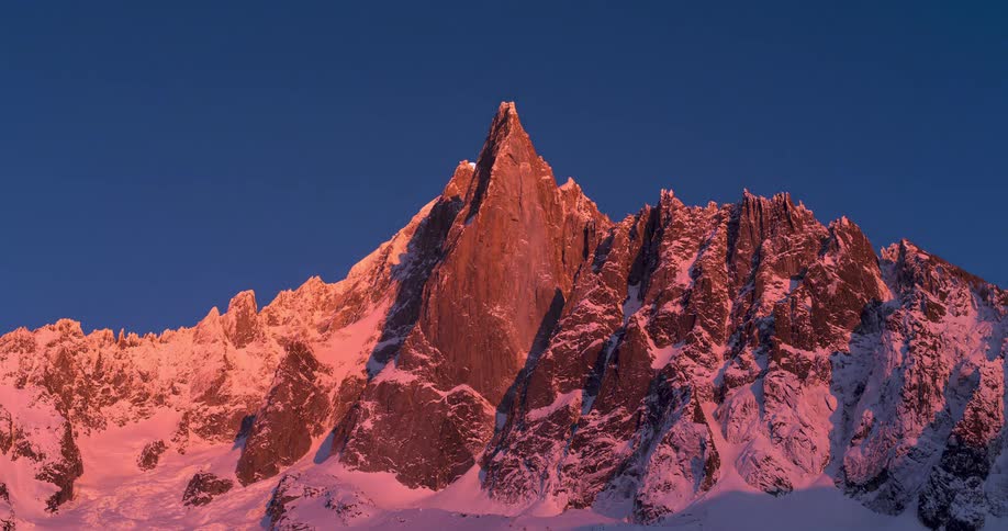 A time lapse shot of a mountain going through day and night