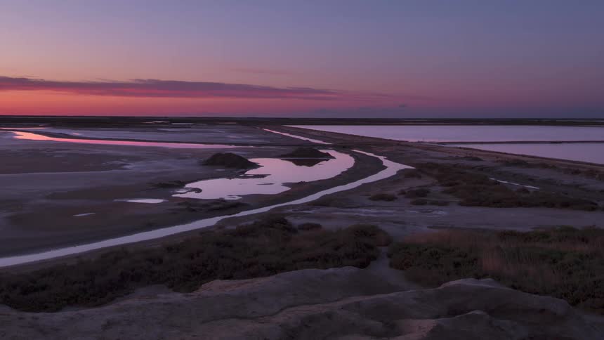 Aerial view of the sun setting in the horizon