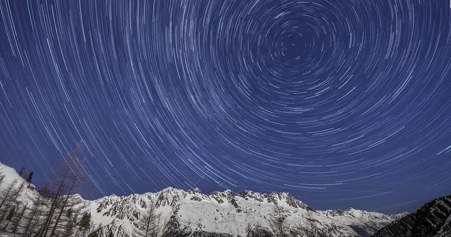 The stars spin above the mountain
